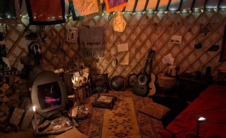 Inside the yurt beside the egg-shaped wood burner